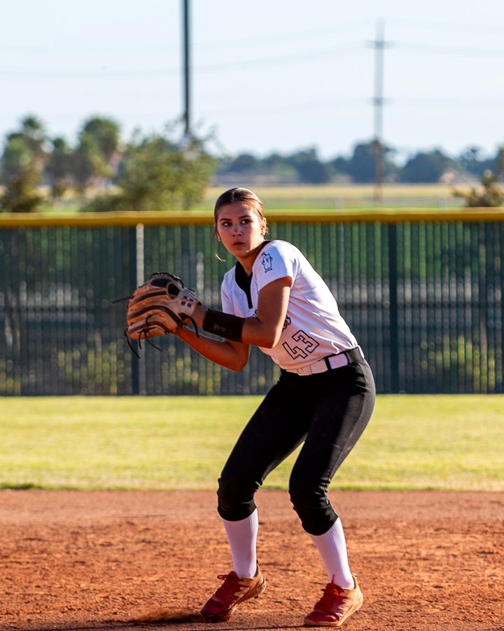 Mia Mead fielding in the middle infield, glove up and set